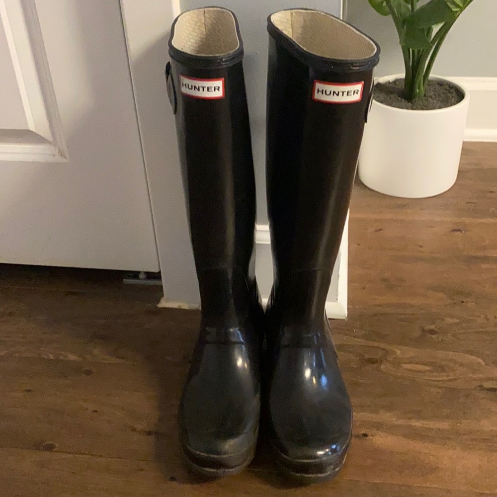 Black tall hunter boots